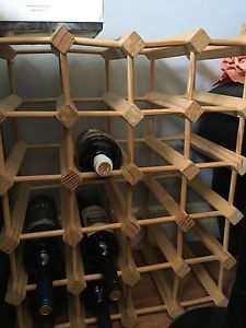 Wine rack holding 24 bottles of wine $30