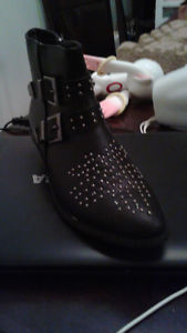 Black boot, never worn, fits size 6-7