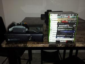 Xbox 360 with 14 games and wireless adaptor. 20GB