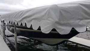Hewett boat lift with canopy and air bags to float in