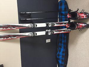Skis boots poles and bag