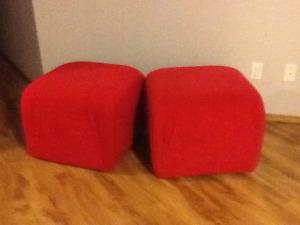 Two red ottomans