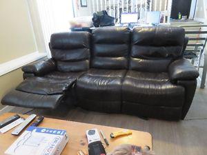 Brown leather reclining sofa
