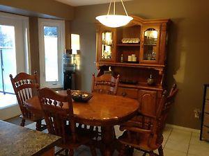 Solid oak table and china cabinet
