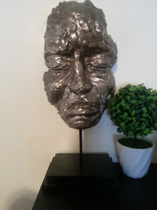 Tribal face mask statue