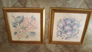 Set of two gold frame floral pictures.
