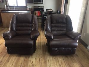 Brown Leather reclining and rocker chairs.
