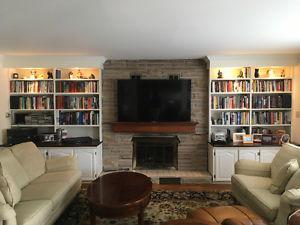 Custom bookshelves and angel stone brick for fireplace.