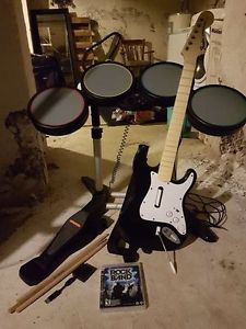 Rockband for PS3, with drumset and guitar.