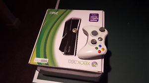 Xbox 360 with two controllers and 15 games.