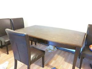 large wood dinning table with 3 chairs
