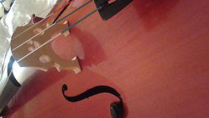 Cello with bow, case, and puck