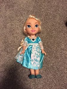 Like new Elsa doll - plays music and lights up