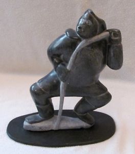 "Man Pulling On Rope" Inuit Carving