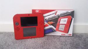 Nintendo 2ds with Mario Kart 7 and 5 themes