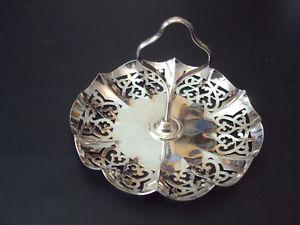 Silver candy dish with central vertical handle 6” diameter
