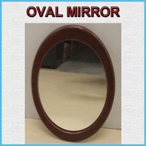 THE MIRROR IS WITHOUT BLEMISHES WITH A BROWN FRAME