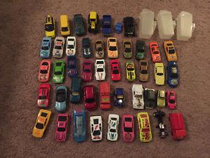 Toy cars and three carrying cases