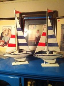 Two wooden sailboats