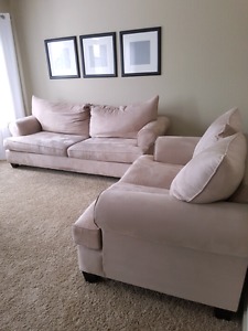 Beige couch and loveseat