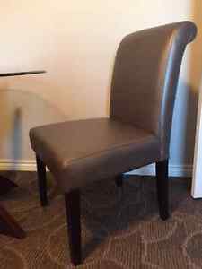 Brand new faux leather dining chairs (2)
