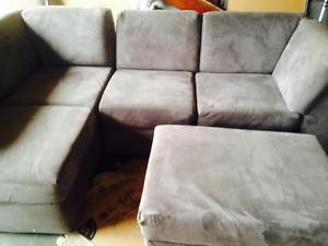 Grey sectional, micro fibre can deliver
