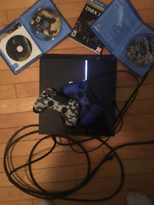 PS4 with 2 controllers and 2 games