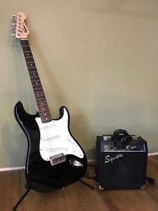 Fender Squier SRAT electric guitar with amp.