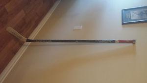 GAME USED CONNOR GARLAND STICK SIGNED