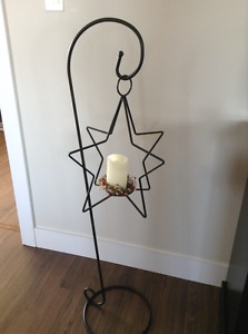 Metal hook stand with metal star candle holder
