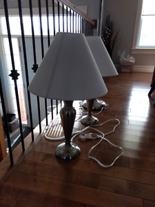 Two table lamps and one tall floor lamp