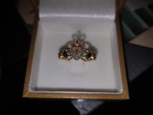 Diamond accented gold claddagh ring!