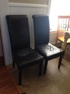 set of two brown leather chairs