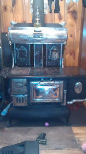 Antique Wood stove with water warmer