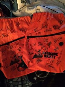 Moose hockey game gym bags signed by players