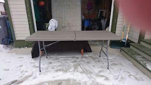 Grey folding table in excellent condition