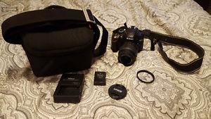 Nikon D w/ extra battery, camera bag and lens protector
