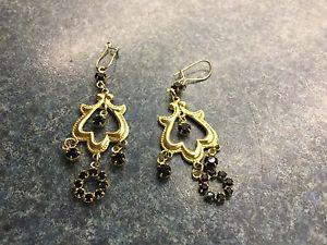 Gold tone and black stone dangly pierced earrings