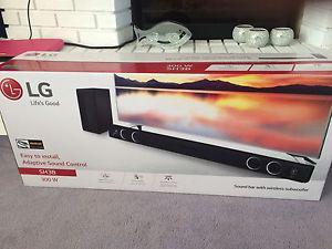 LG sound bar and subwoofer *new in box