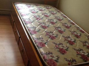 Solid wooden bed with mattress