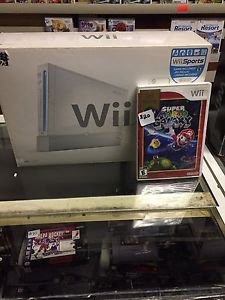 Wii in box with 2 games