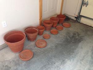 6 terra cotta pots with saucers
