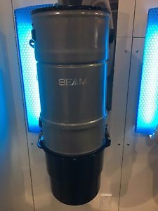 Beam built in vacuum and hose