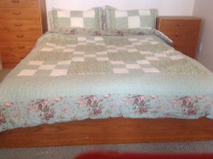 Queen size bed cover with pillow shams.