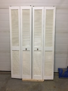 TWO BIFOLD LOUVERED DOORS