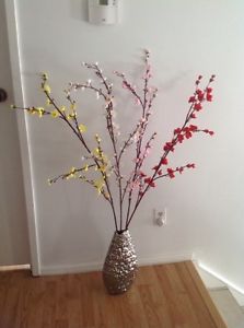 Tall vase with tall cherry blossom flowers