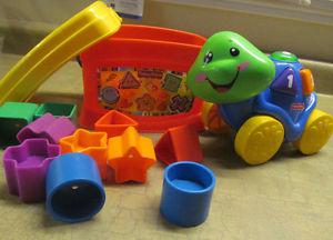 Fisher-Price Roll Along Turtle AND Shapes puzzle bucket.