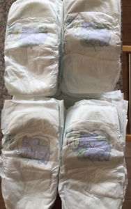 **TWO SLEEVES OF SIZE 5 DIAPERS FOR SALE**