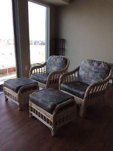 2 wicker chairs with ottomans
