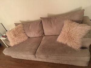 Beige couch and love seat